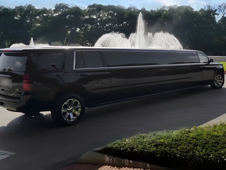 Chevy Super Stretch limousine at the Mecom Fountain — Houston Limo Chauffeur
