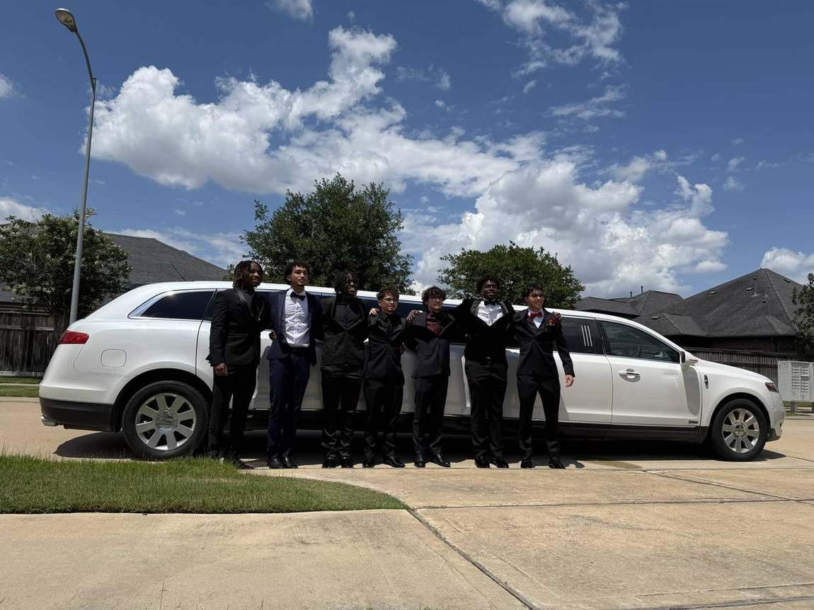 Prom night group Lincoln MKT limousine wide — Houston Limo Chauffeur