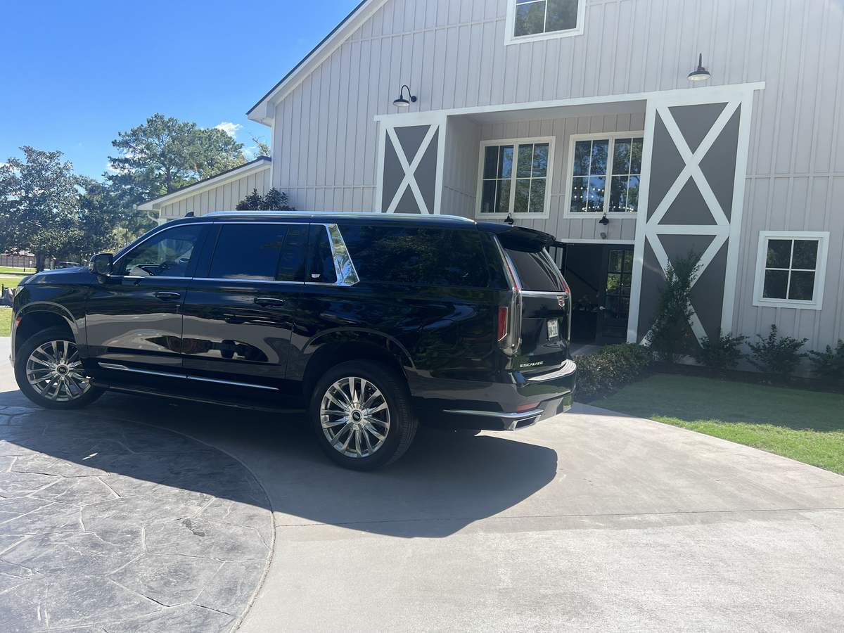 The Woodlands Cadillac Escalade barn rear — Houston Limo Chauffeur